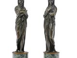 pair of bronze figurines of a woman holding a child