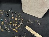 several pieces of jewelry are displayed on a black surface