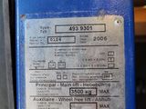 a close up of a blue machine with a label on it