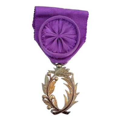 an image of a medal with a purple ribbon around it