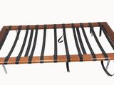 a wooden bed frame with black stripes on it