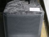 two speakers sitting next to each other on a pallet