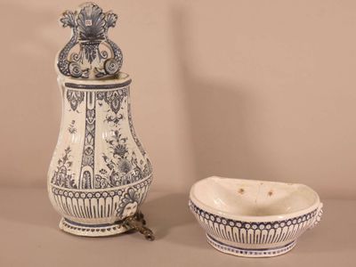 a white and blue vase and a bowl on a table