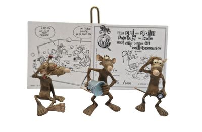 three figurines of three monkeys with a book and a sign