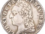 une pièce d'argent portant l'image d'une tête de femme