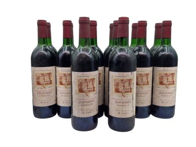 six bottles of red wine are lined up in a row