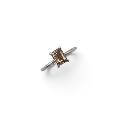 a close up of a ring on a white surface