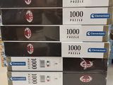 several boxes of pizza are stacked on top of each other in a store