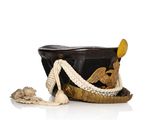 a black hat with a rope around it on a white surface