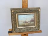 a picture of a painting on a easel on a table