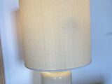 a lamp that is sitting on a table in a room