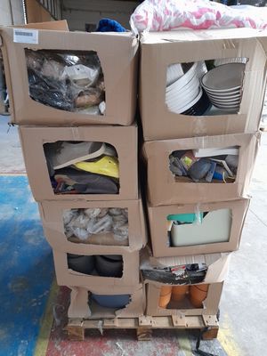 boxes stacked on top of each other on a pallet in a warehouse