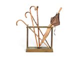 a wooden stand with umbrellas and umbrella poles in it