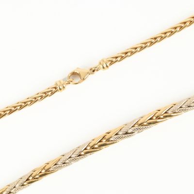 a gold chain with a braid design on it