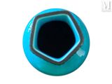 a blue vase with a black top on a white surface