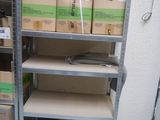 many boxes on the shelves in the room