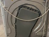 a washing machine that is sitting on the floor