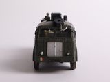 a toy army vehicle with a man sitting on top of it