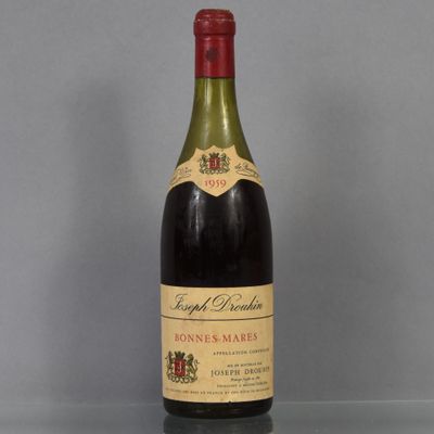 a bottle of wine that is sitting on a table