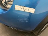 a close up of a blue motorcycle with a sticker on it