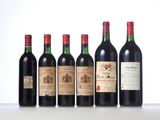 six bottles of wine are lined up on a table