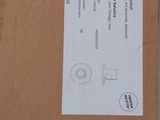 a cardboard box with a label on it sitting on a table