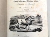 un vieux livre avec l'image d'un lion dessus