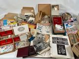 many different types of stamps and envelopes on the table