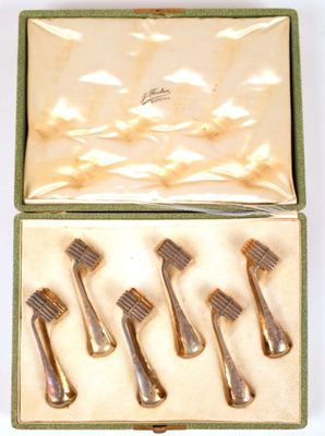 a box that has five different types of hair brushes in it