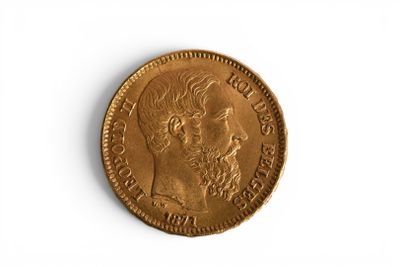 a close up of a coin on a white surface