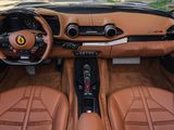 the interior of a sports car with leather seats and dashboard controls