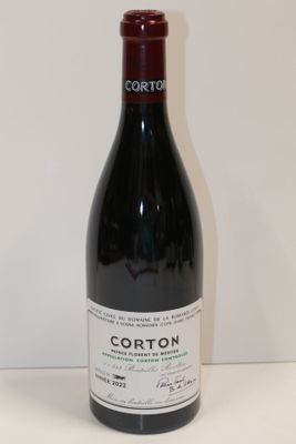 a bottle of wine that is sitting on a table