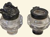 two glass jars that have flowers on them