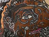 a painting of a man with a beard on a wall