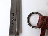 a pair of scissors next to a knife on a table
