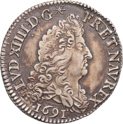 une pièce d'argent portant une tête de femme et une couronne