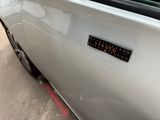 a close up of a car with a sticker on it