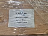 a plastic wrap on a table that has a sign on it