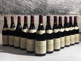 bottles of wine lined up in a row on a table
