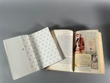 an open book with a picture of a man in a suit and tie on it