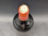 a bottle of wine that is sitting on a table