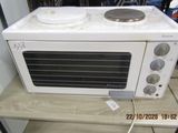 a white microwave sitting on top of a wooden table