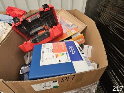 a cardboard box full of assorted items in it