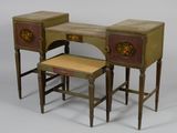 a small desk with two stools next to it