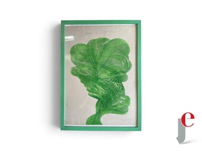 un motif de feuilles vertes dans un cadre vert accroché à un mur blanc