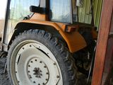 a tractor that is parked in a garage