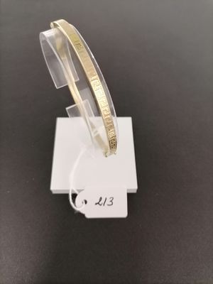 a close up of a bracelet on a stand on a table
