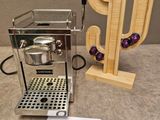a coffee maker and a cactus on a table