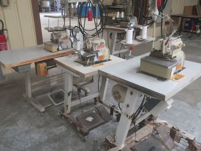 two sewing machines that are sitting on a table