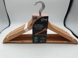 a wooden hanger that has a box of clothes on it